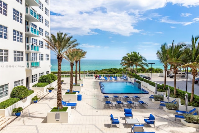 view of pool featuring a water view