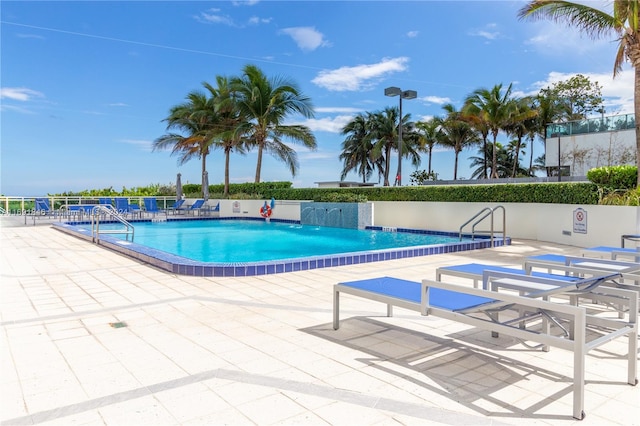 view of swimming pool featuring a patio area