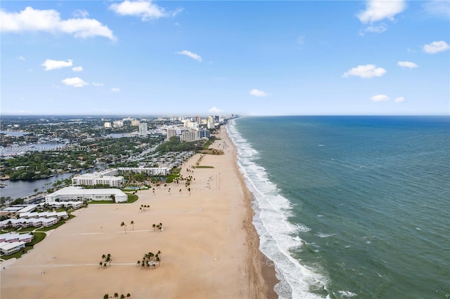 aerial view featuring a water view and a beach view