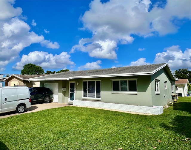 ranch-style house featuring a garage and a front yard