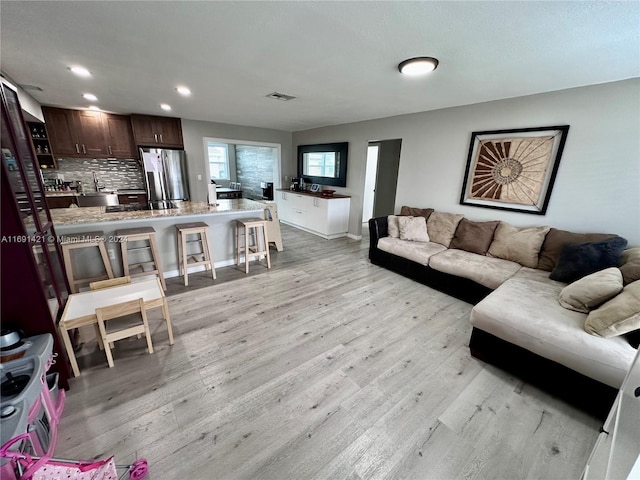 living room featuring light wood-type flooring