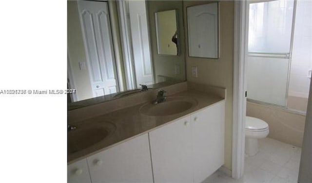 full bathroom featuring vanity, toilet, and washtub / shower combination