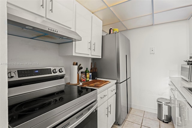 kitchen featuring white cabinetry, light tile patterned floors, and appliances with stainless steel finishes