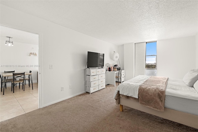 carpeted bedroom with a textured ceiling