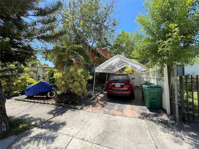 view of vehicle parking featuring a carport