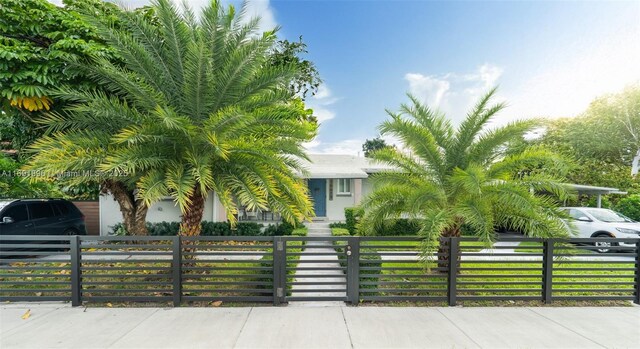 view of property hidden behind natural elements