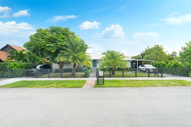 view of front facade with a carport