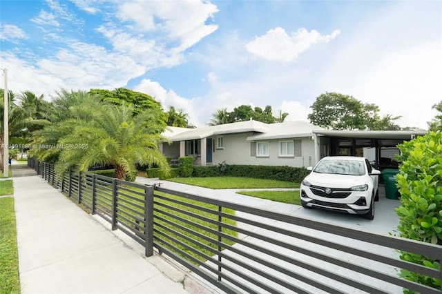 view of front facade with a carport