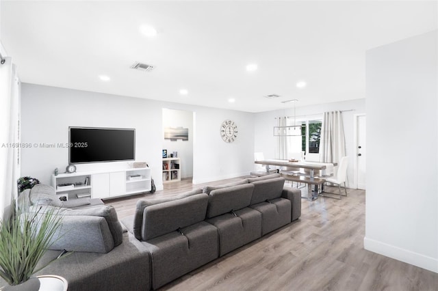 living room with light hardwood / wood-style floors