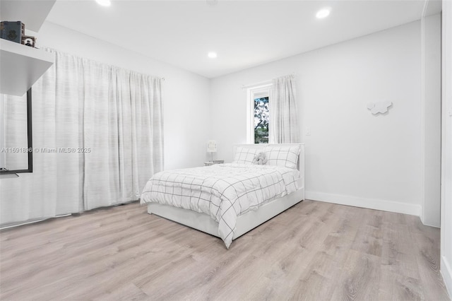 bedroom with light wood-type flooring