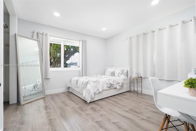 bedroom with light hardwood / wood-style floors