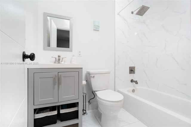 full bathroom with vanity, toilet, and tiled shower / bath