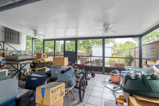 back of house with a yard, central air condition unit, a patio area, and a sunroom