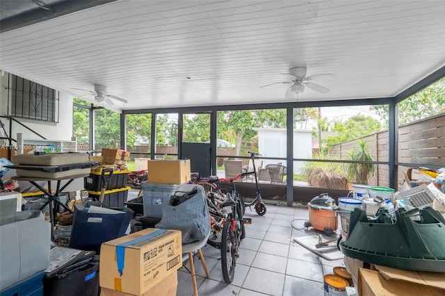 sunroom featuring ceiling fan