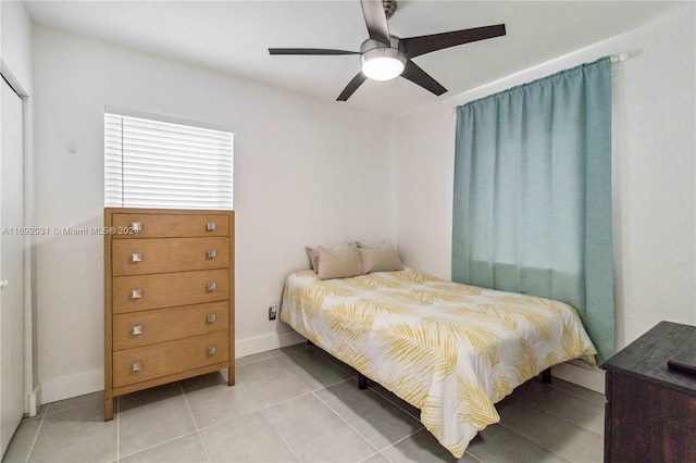 bedroom with light tile patterned floors and ceiling fan