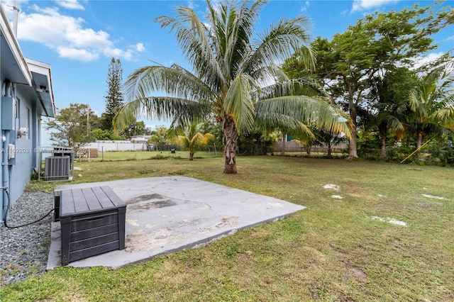 view of yard with a patio and central AC