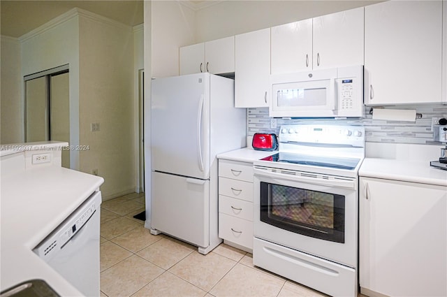 kitchen with white cabinets, decorative backsplash, white appliances, and light tile patterned floors