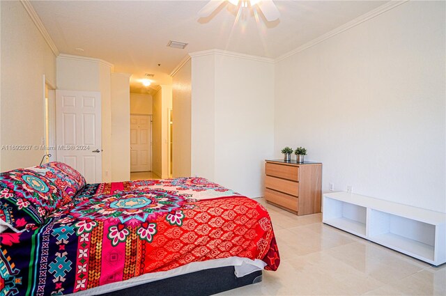 bedroom featuring tile patterned flooring, ceiling fan, and crown molding