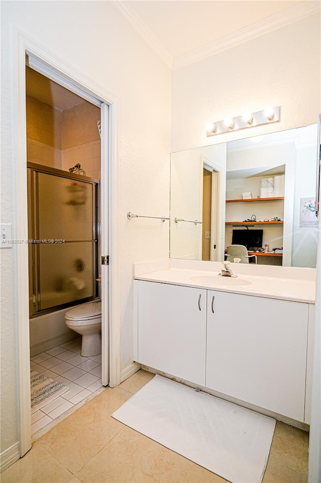 full bathroom with combined bath / shower with glass door, tile patterned floors, toilet, vanity, and ornamental molding