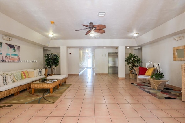 interior space with ceiling fan and light tile patterned floors