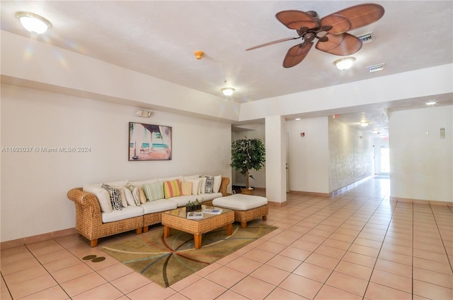 living room featuring ceiling fan and light tile patterned flooring