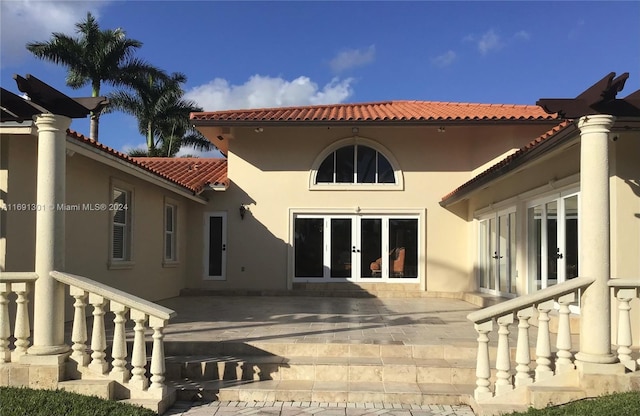 back of house featuring a patio area and french doors