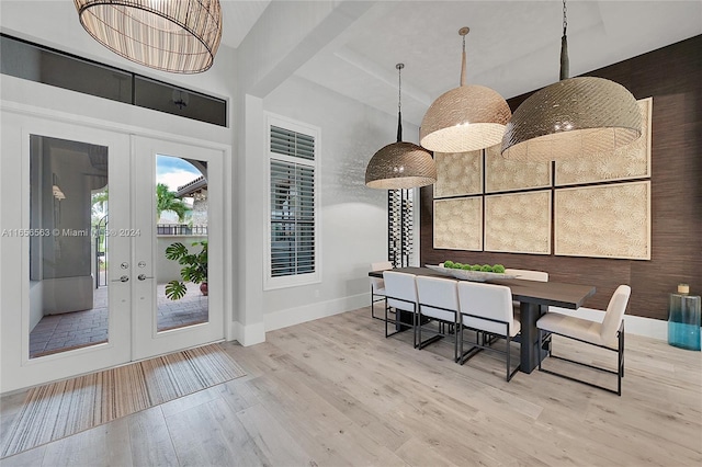 unfurnished dining area with light hardwood / wood-style floors and french doors