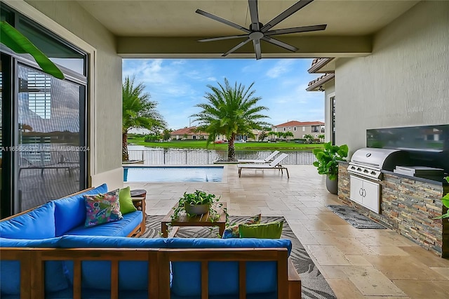 view of patio with a water view, grilling area, ceiling fan, an outdoor hangout area, and area for grilling