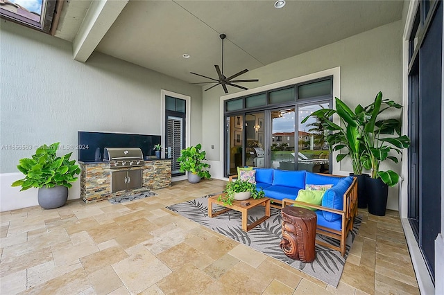 view of patio with grilling area, area for grilling, ceiling fan, and an outdoor hangout area