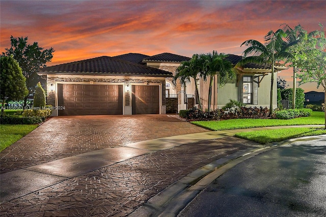 mediterranean / spanish-style home with a garage