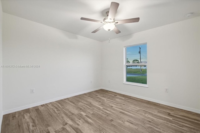 empty room featuring ceiling fan and light hardwood / wood-style floors