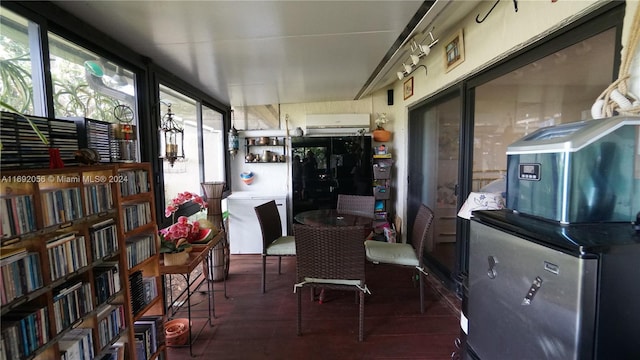 sunroom with a wall unit AC