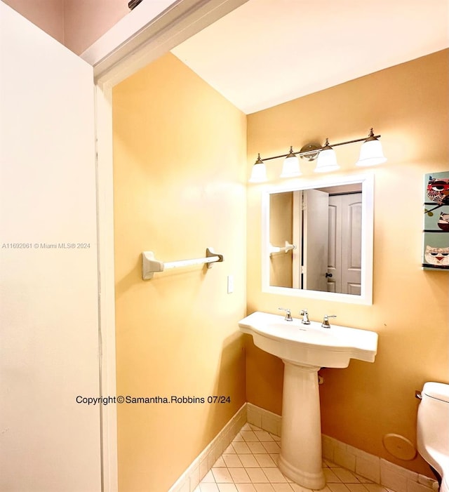 bathroom with tile patterned floors and toilet