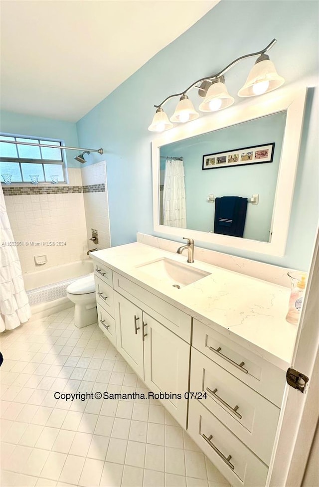 full bathroom featuring toilet, shower / bath combo, vanity, and tile patterned floors