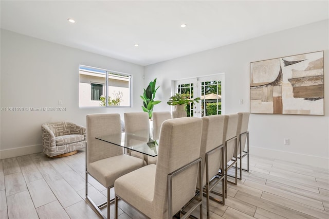 dining space with light hardwood / wood-style flooring