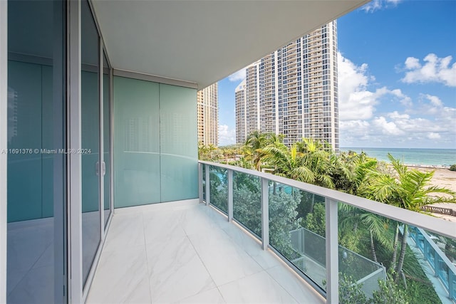 balcony featuring a water view