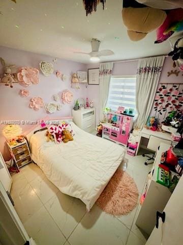 bedroom featuring tile patterned floors and ceiling fan