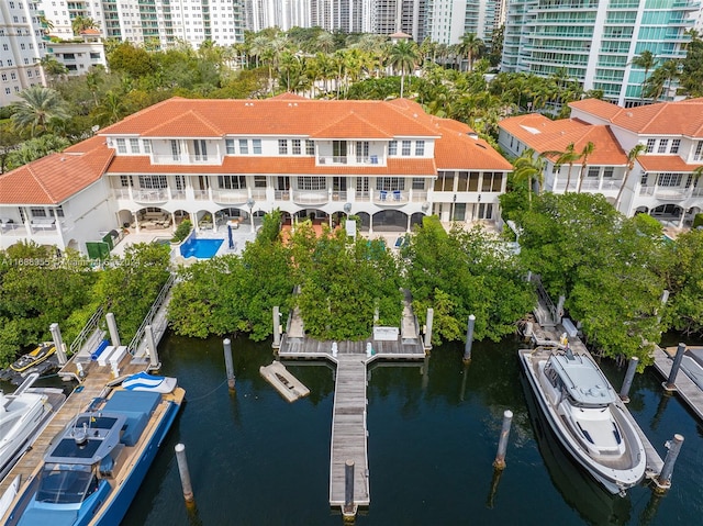 birds eye view of property with a water view