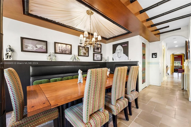 dining room with a notable chandelier