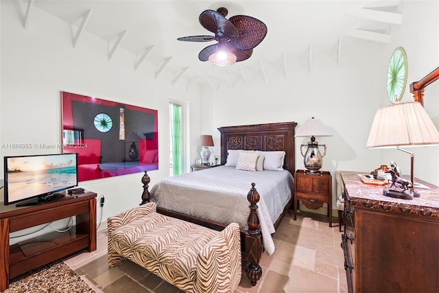 bedroom with beamed ceiling and ceiling fan