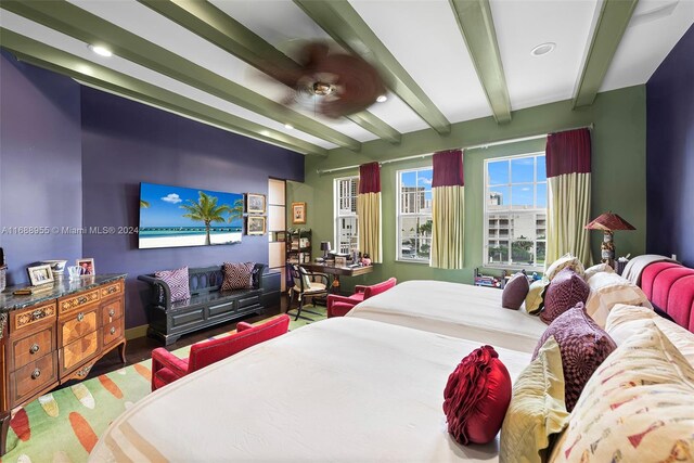 bedroom with hardwood / wood-style flooring and beam ceiling