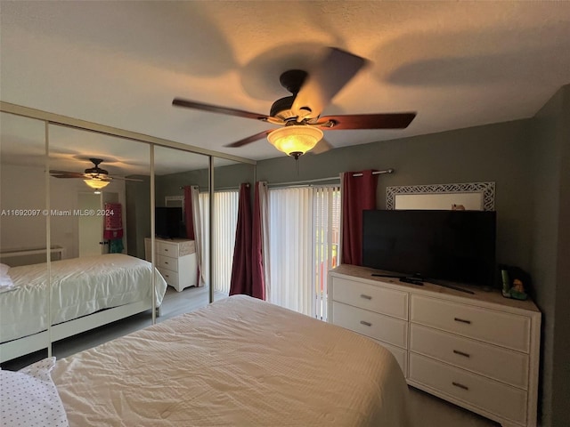 bedroom featuring ceiling fan and a closet