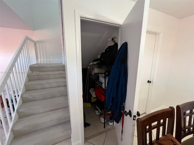 staircase with tile patterned floors