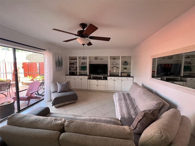 living room with ceiling fan and light tile patterned floors