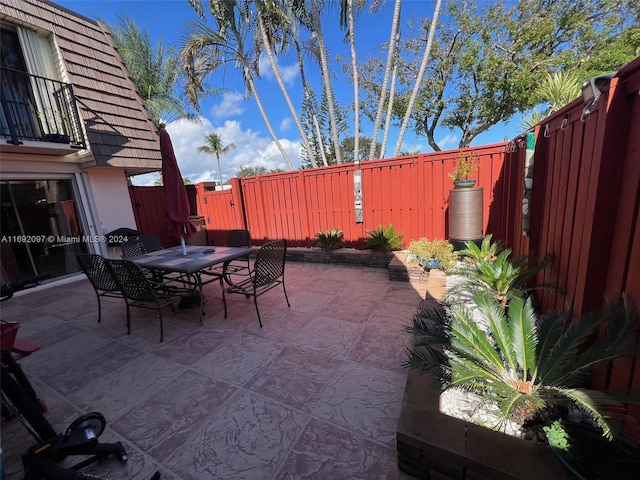 view of patio with a balcony