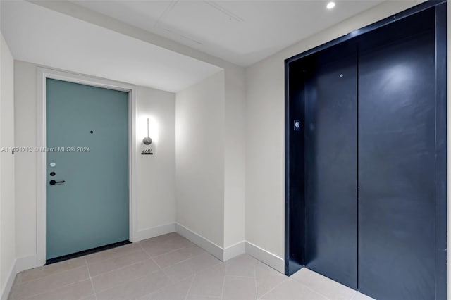 interior space with light tile patterned floors