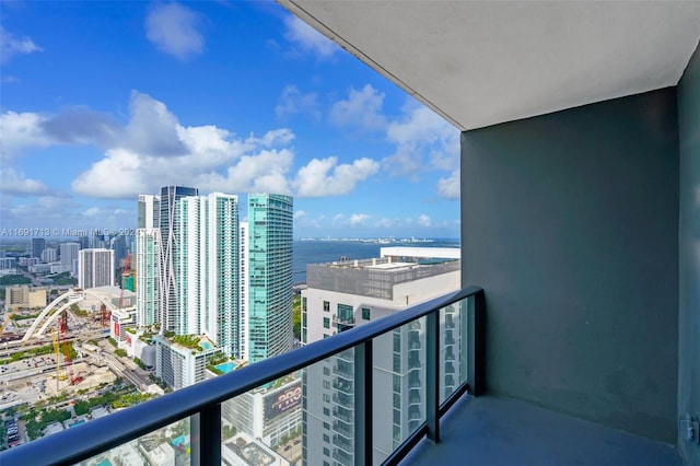 balcony featuring a water view