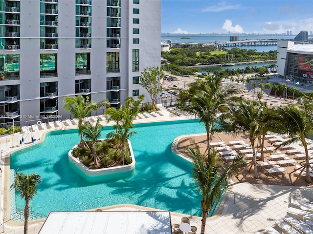 view of swimming pool with a water view