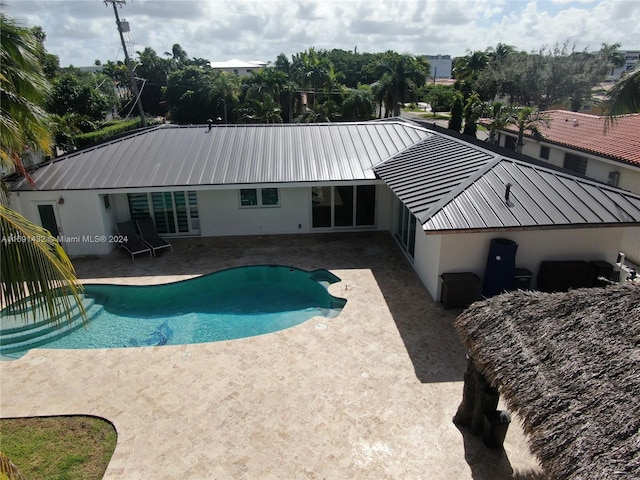 view of swimming pool featuring a patio area