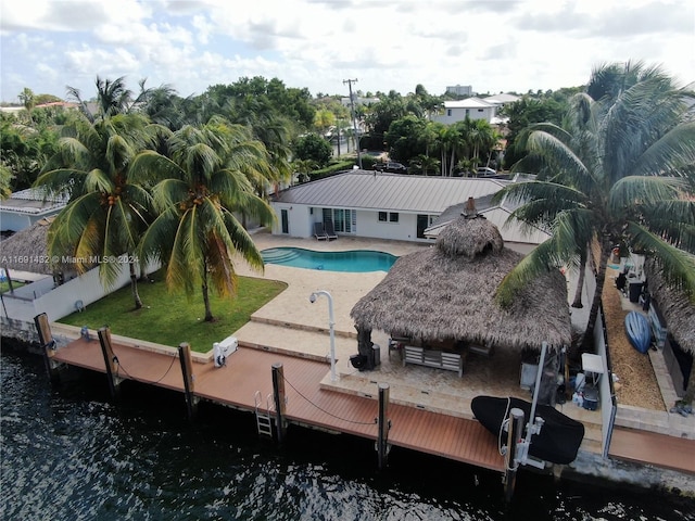 back of property featuring a patio and a water view